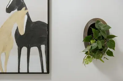 a picture of a horse and a plant on a wall at Am Flus- at the river in Stellenbosch