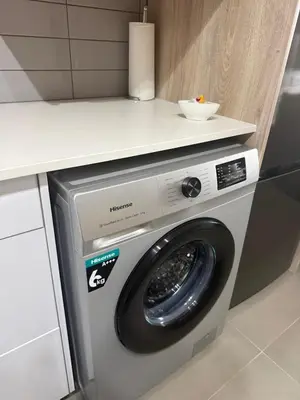a washing machine with a counter on top of it at Modern stay overlooking Durbanville wine country in Durbanville