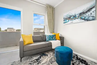 a living room with a couch and a window at The Orion 16 in Table View