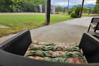 a bench in a park with a blanket on it at Bed and Biscuits in Windmeul