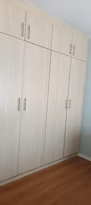 a row of white cabinets in a room at Accomodation in Cape Town in Goodwood