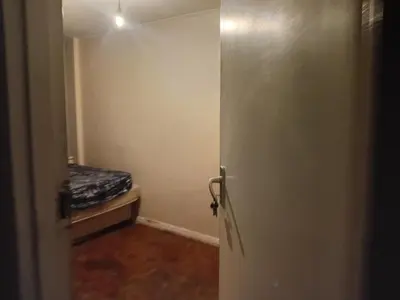 an open door to a room with a bed at Emilia in Bellville