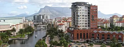 a view of a city with a river and buildings at Ezey Tours-Manhattan Suites in Cape Town