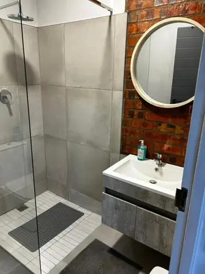 a bathroom with a sink and a mirror at Alicante in Worcester
