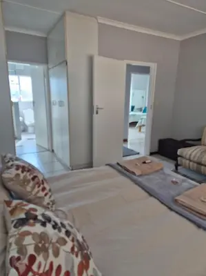 a room with a bed and a living room at Sune's self catering 2 in Worcester