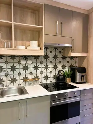 a kitchen with a sink and a counter top at Bachelors Unit at The Den in Stellenbosch