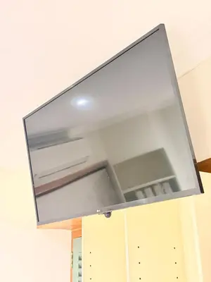 a large mirror hanging from a kitchen ceiling at Lux in Paarl