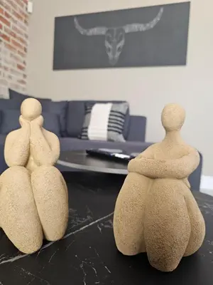 three wooden objects sitting on a table in a living room at Cape Town Glam in Welgemoed