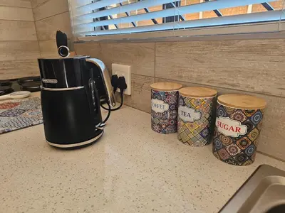 a coffee maker on a counter in a kitchen at Cape Town Glam in Welgemoed