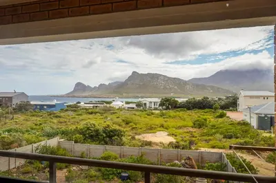 a view of the mountains from the balcony of a house at Leah's View in Pringle Bay