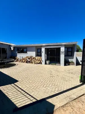 a house with a brick driveway in front of it at Angel's Cottage in Paarl