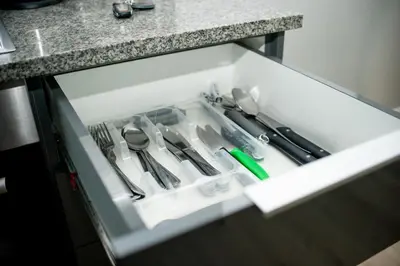 a drawer with scissors and other kitchen utensils at Sea Facing 2 Bedroom Apartment In Burmeister On Park, Milnerton in Cape Town