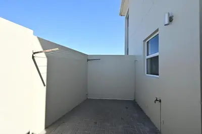 a garage with a white wall and a window at The lodge in Cape Town