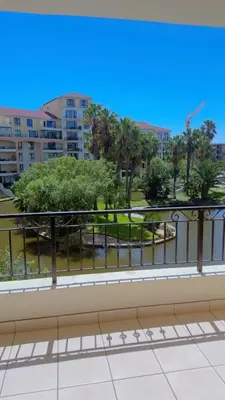 a balcony with a view of a park at De Groove Luxury Homes in Cape Town