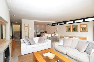 a living room with two white couches and a table at bamboo @ Le Paradis in Hermanus