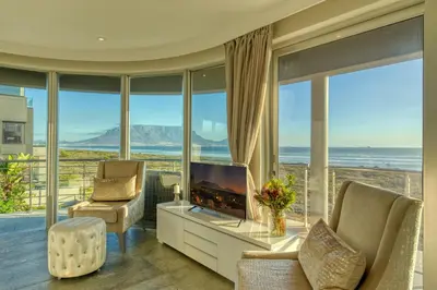 a living room with a view of the ocean at Atlantic Palms in Cape Town