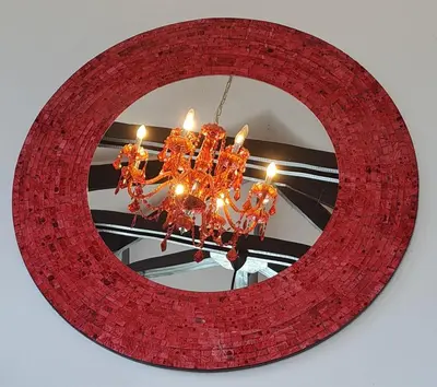 a red chandelier in front of a mirror at Domaine Coutelier in Stellenbosch