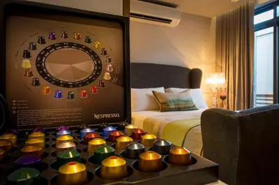 a room with a bed and a display of candles at Nicara to Akker Collective in Stellenbosch