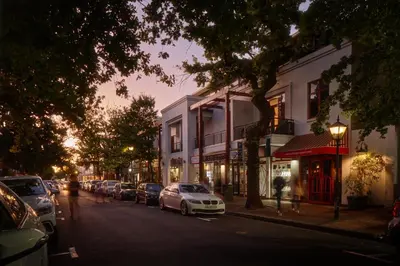 a street with cars parked on the side of the road at 22 Eikehoff Apartment in Stellenbosch