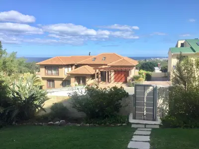 a house with a view of a yard at Hermanus Heights Villa in Hermanus