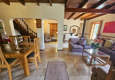 a living room with a couch and a table at Rawsonville House in Rawsonville