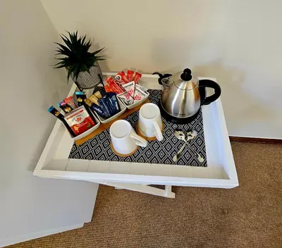 a table with a tea kettle on top of it at Rawsonville House in Rawsonville