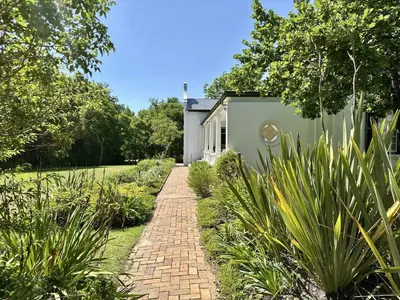 a brick path in front of a house at Le Manse in Franschhoek
