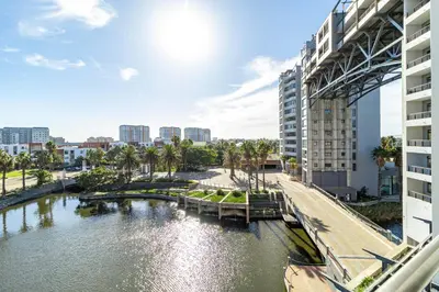a view of a river in a city with buildings at Citystay Apartments Century City in Cape Town