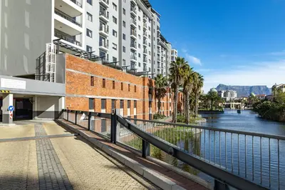 a view of a river in a city with buildings at Citystay Apartments Century City in Cape Town