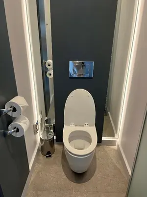 a bathroom with a white toilet in a stall at Cape Town Marriott Hotel Crystal Towers in Cape Town