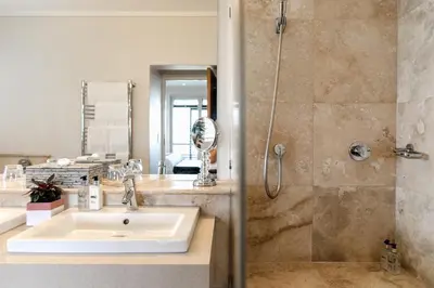 a bathroom with a sink and a shower at Selkirk House in Hermanus