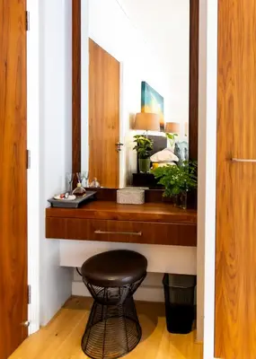 a bathroom with a counter with a stool next to a sink at Selkirk House in Hermanus