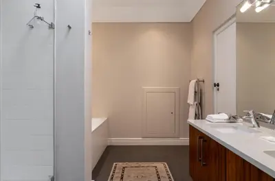 a bathroom with a shower and a sink and a tub at Wild Mushroom Country House in Stellenbosch