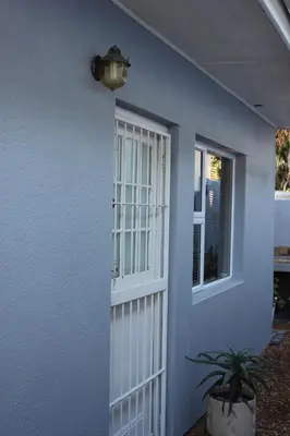 a white door with a window on a house at 25 on Fitzpatrick in Parow