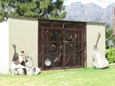 a shed with a bunch of pots and pans at Seven Oaks Vineyard Cottages in Wolseley