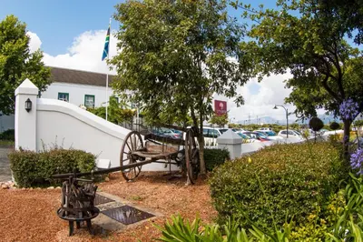 a cannon in front of a white building at City Lodge Hotel GrandWest in Epping