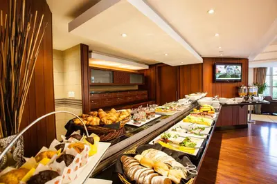 a buffet line with many different types of food at City Lodge Hotel Pinelands in Cape Town