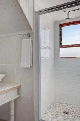 a bathroom with a shower and a sink at Beautiful Abalone in Hermanus