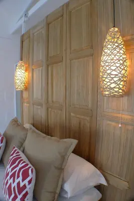 a room with two lamps and pillows on a couch at Pashasha Beach House and Hot Tub in Hermanus