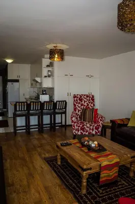 a living room with a couch and a coffee table at Greenways Emerald Bay in Strand