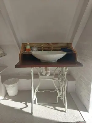 a sink on top of a table in a room at Kimi's Cottage in Simondium