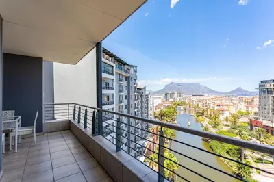 a balcony with a view of a city at Knightsbridge Luxury Suite in Century City by CTHA in Cape Town