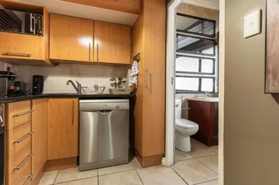 a kitchen with a sink and a dishwasher at Avemore Eikehoff No 24 full back up power in Stellenbosch