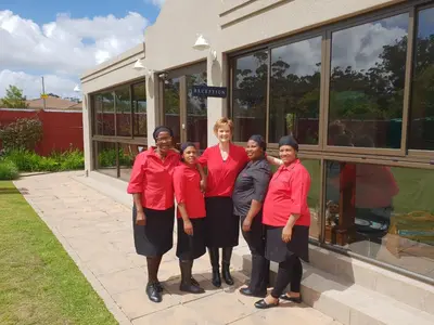a group of people standing in front of a building at Dilisca Guesthouse in Durbanville