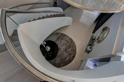 a spiral staircase in a building with a circular staircase at Ocean View Penthouse in Strand
