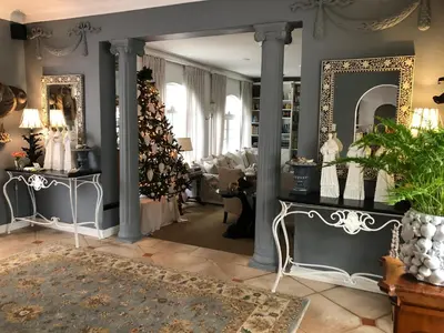 a living room with a christmas tree in the corner at Our Hermanus House in Hermanus