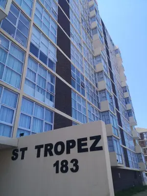 a st properties sign in front of a building at 308 St Tropez in Strand