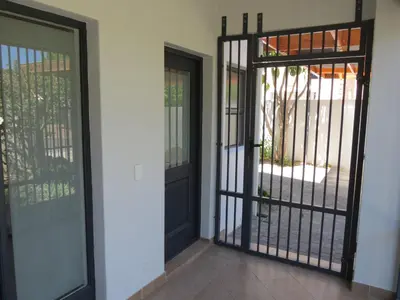 an entry door to a house with wrought iron gates at 10 Kommandeurs Ave, Stellenbosch in Stellenbosch