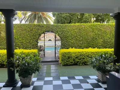 an entrance to a garden with a gate and plants at The Prime Spot in Worcester