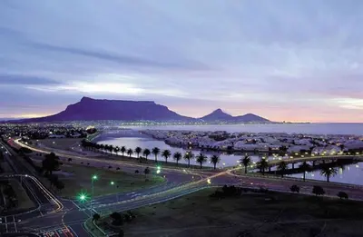 a view of a city with the ocean and mountains at Key West 417 by CTHA in Cape Town